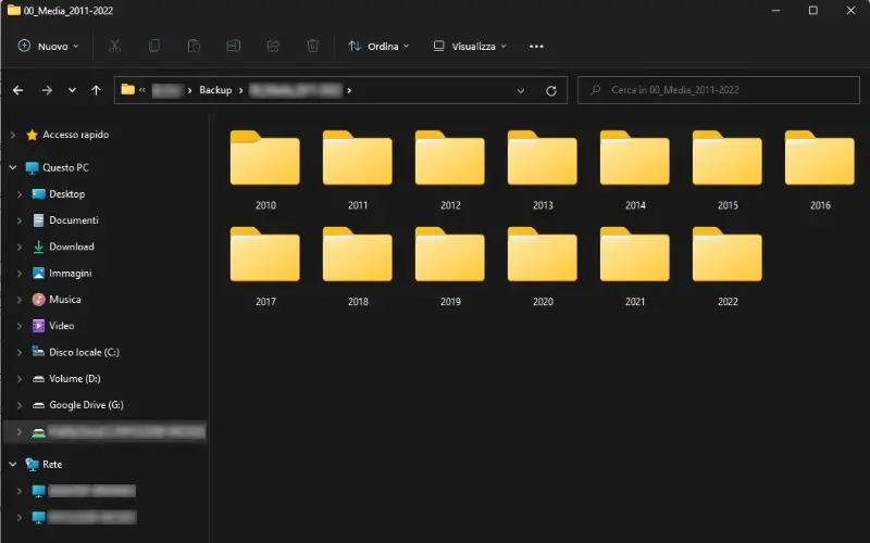 Screenshot of thirteen yellow folders of Diana’s photos, labeled by year from 2010 to 2022
